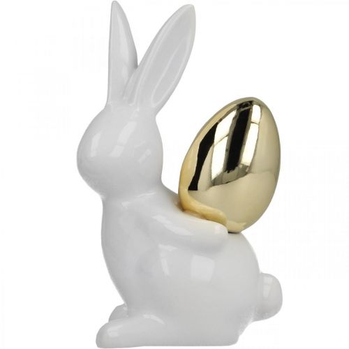 Prodotto Conigli con uovo d&#39;oro, conigli in ceramica per Pasqua bianco nobile, dorato H13cm 2pz