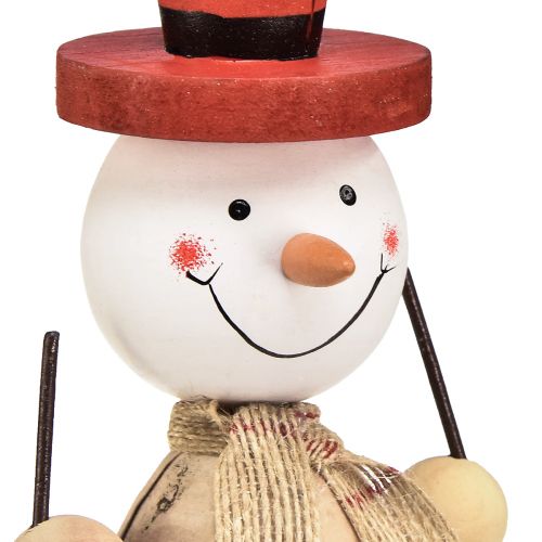 Prodotto Pupazzo di neve figura decorativa in legno con cappello rosso naturale H20,5 cm